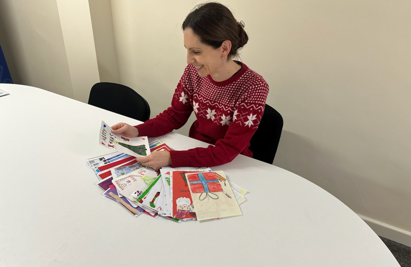 Aphra Brandreth deciding the winner of her 2024 Christmas Card Competition