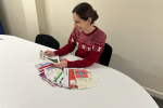 Aphra Brandreth deciding the winner of her 2024 Christmas Card Competition